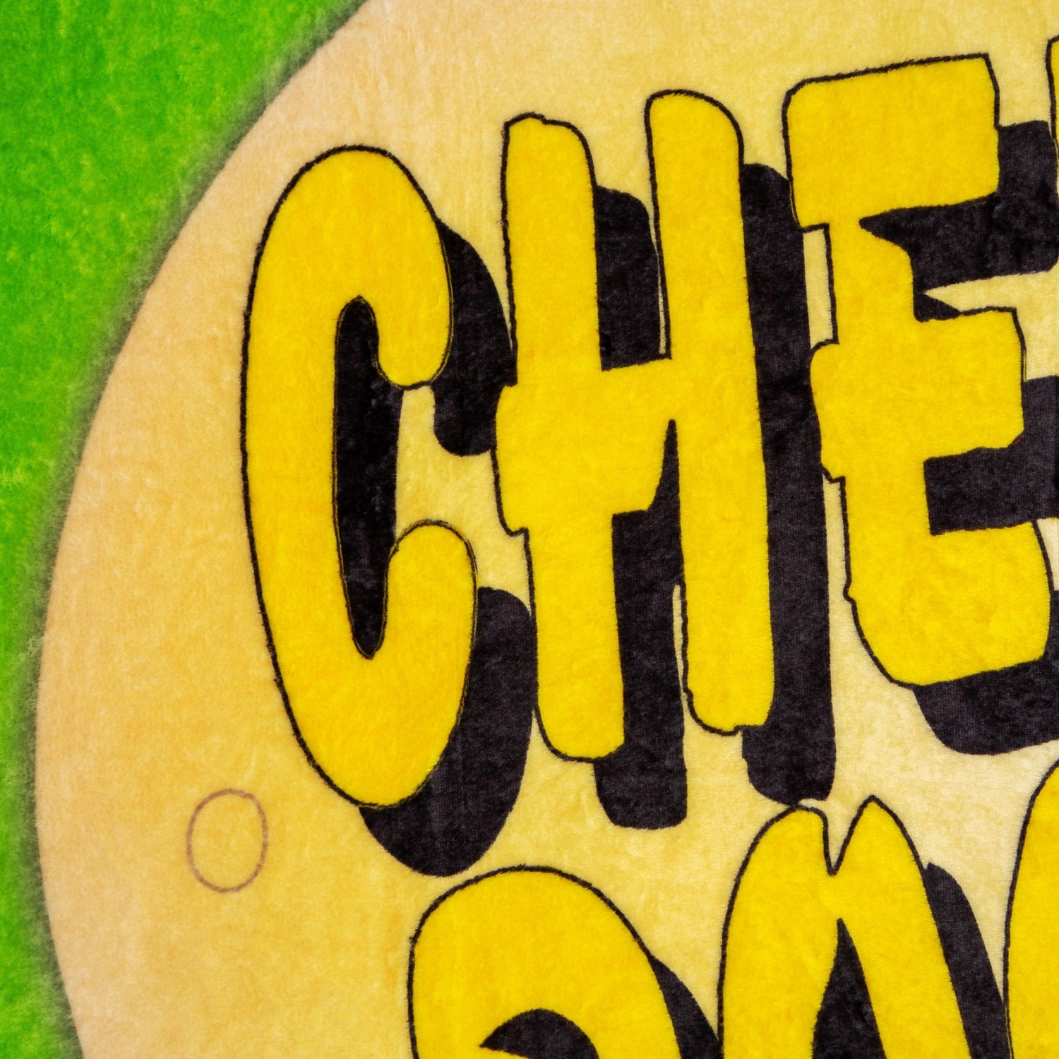 Close-up of the South Park Cheesy Poofs blanket graphic featuring the iconic cartoon snack mascot