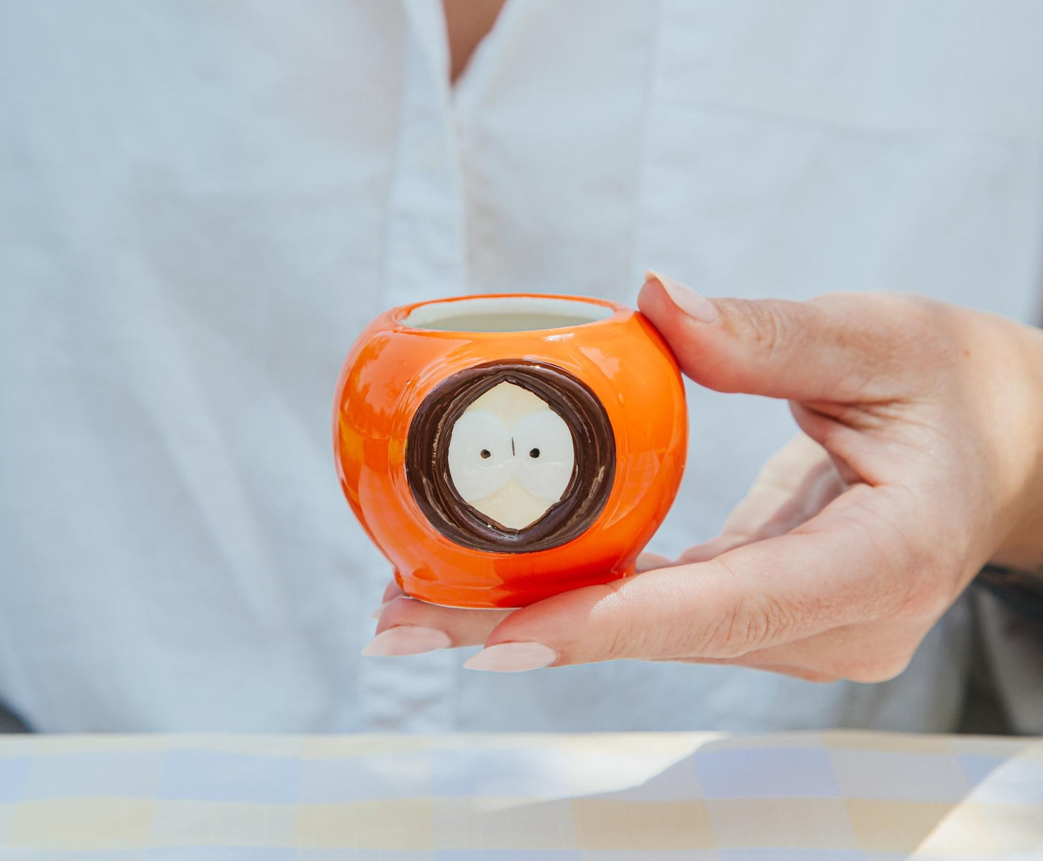 South Park mini mug shown alongside a reference item for scale
